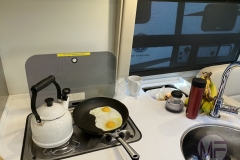 Cooking eggs while the kids do distance learning